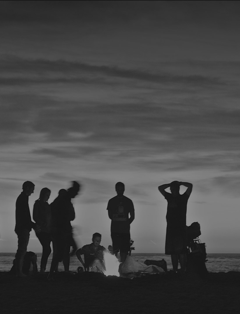 People at beach bonfire